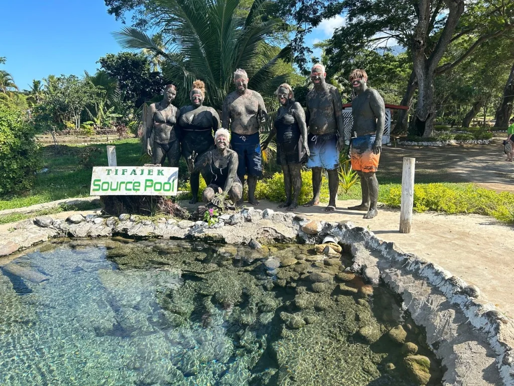 Visitor enjoying Fiji hot springs at Sabeto mud pool near Nadi