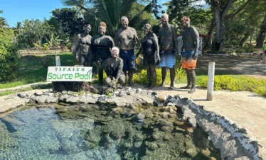 Visitor enjoying Fiji hot springs at Sabeto mud pool near Nadi