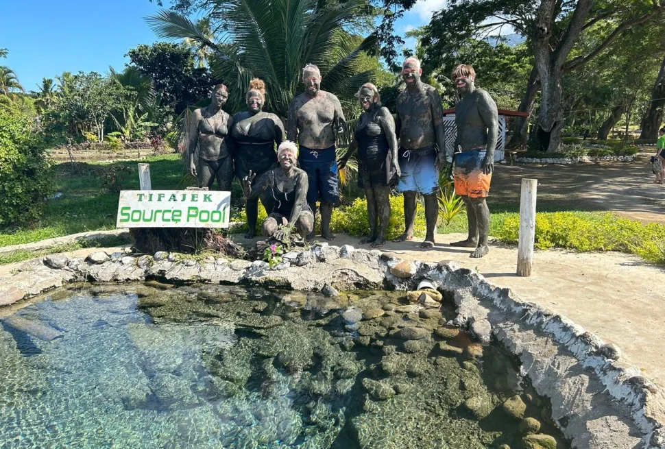 Visitor enjoying Fiji hot springs at Sabeto mud pool near Nadi
