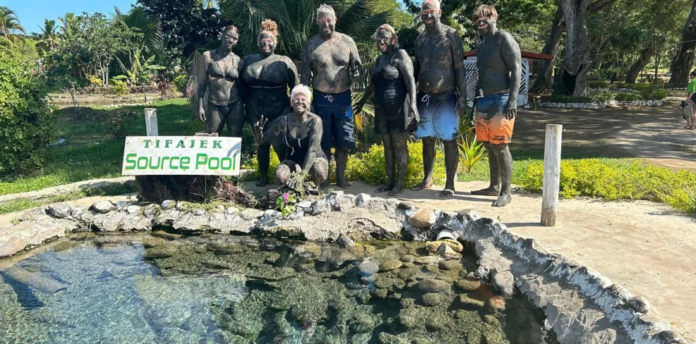Visitor enjoying Fiji hot springs at Sabeto mud pool near Nadi
